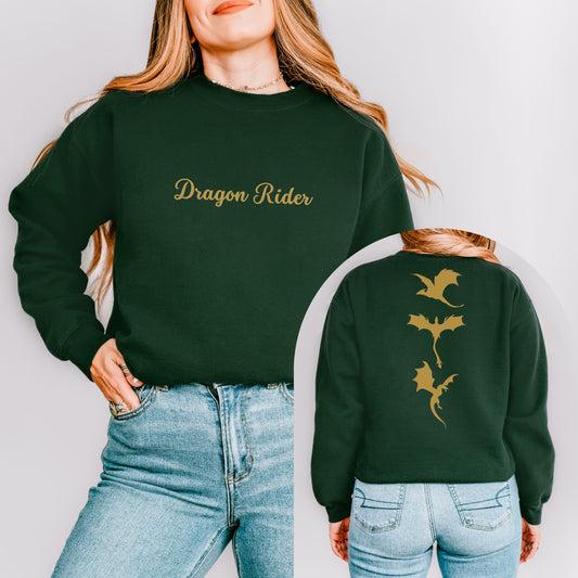 The dragon rider sweatshirt has a 
design of three golden dragons on the back and in the front the text dragon rider in a Calligraphy font. The text is embroidered. 
The model wears the colour forest green.