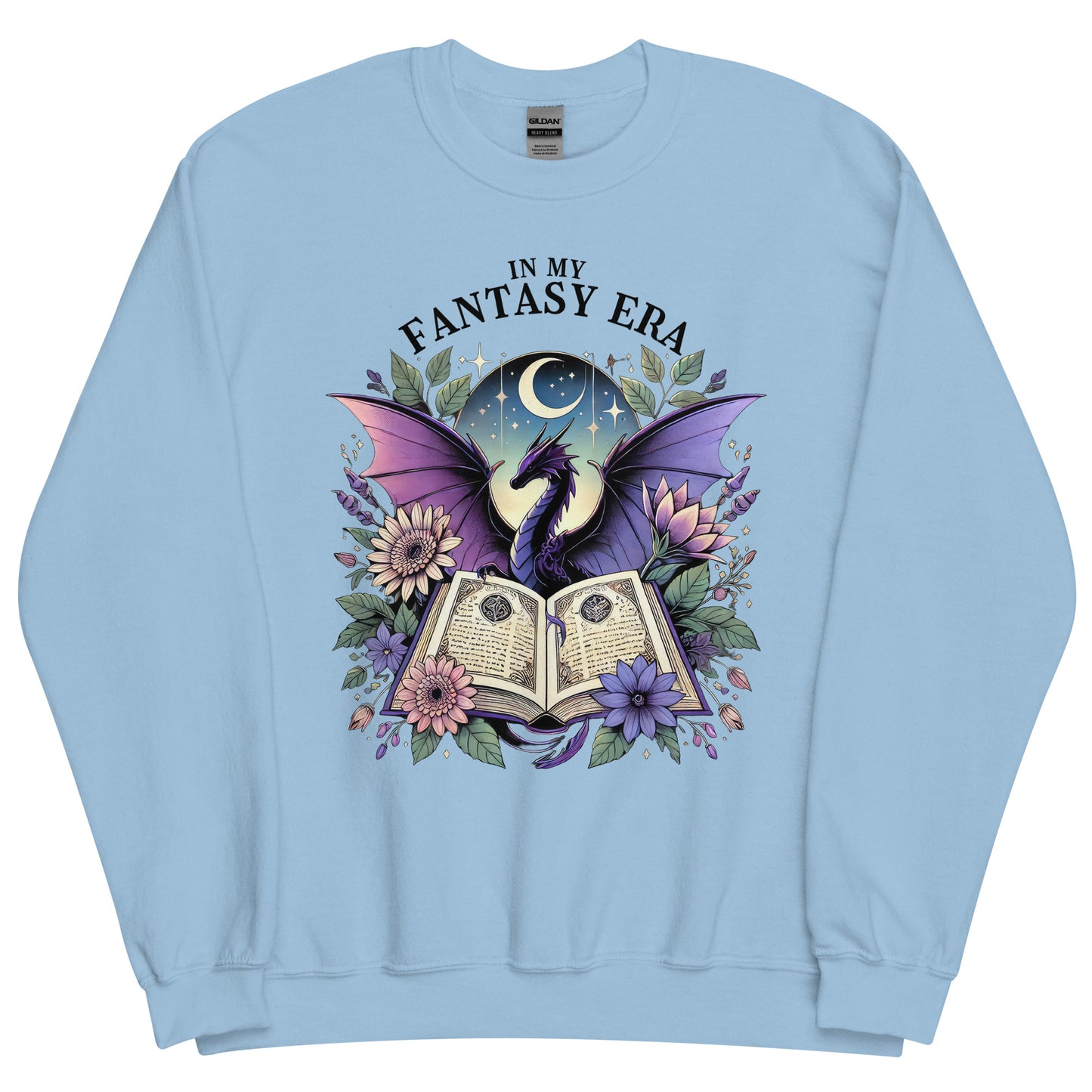 The in my fantasy era sweatshirt has a design of a purple dragon behind an open fantasy book and they are surrounded by purple and pink flowers. The text above the dragon says: in my fantasy era.
This sweatshirt is the colour light blue.