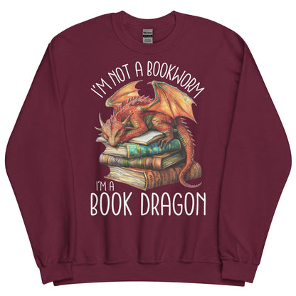 The book dragon sweatshirt has a design of a sleeping dragon on top of stacked books. The text says, "I'm not a bookworm. I'm a book dragon."
The colour of this sweatshirt is maroon.