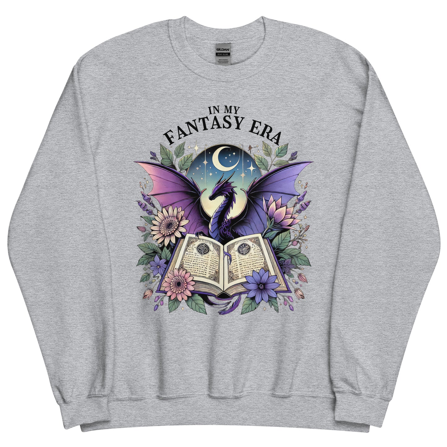 The in my fantasy era sweatshirt has a design of a purple dragon behind an open fantasy book and they are surrounded by purple and pink flowers. The text above the dragon says: in my fantasy era.
This sweatshirt is the colour sport grey.