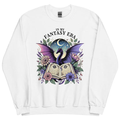 The in my fantasy era sweatshirt has a design of a purple dragon behind an open fantasy book and they are surrounded by purple and pink flowers. The text above the dragon says: in my fantasy era.
This sweatshirt is the colour white.