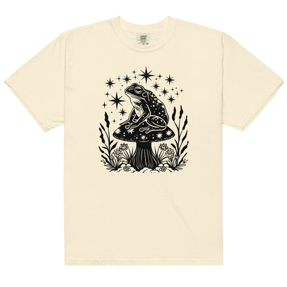 The celestial mushroom and frog t-shirt has a design of a frog sitting on a mushroom that's covered in celestial stars. 
The colour of this t-shirt is ivory.