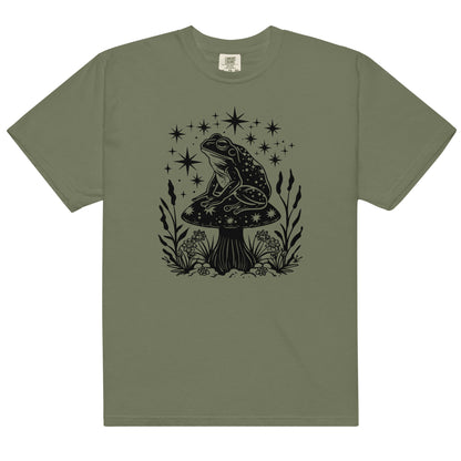 The celestial mushroom and frog t-shirt has a design of a frog sitting on a mushroom that's covered in celestial stars. 
The colour of this t-shirt is moss.