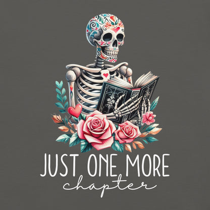 The just one more chapter t-shirt has a design of a skeleton reading a book. A funny joke amongst book lovers. Because we cannot put down a good book.
This is a close up of the direct on garment design.